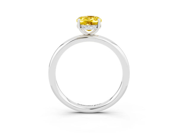 Platinum Oval Cut Yellow Sapphire Solitaire Ring with Thin Band and Four-Prong Setting