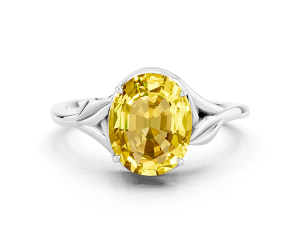 Platinum Oval Cut Yellow Sapphire Solitaire Ring with Twist Band and Four-Prong Setting