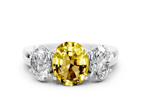 White gold Oval Cut Yellow Sapphire Three-Stone Ring with Four-Prong Setting and Classic Band