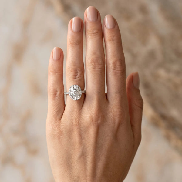 White gold Oval Diamond Bezel Halo Ring with Plain Band