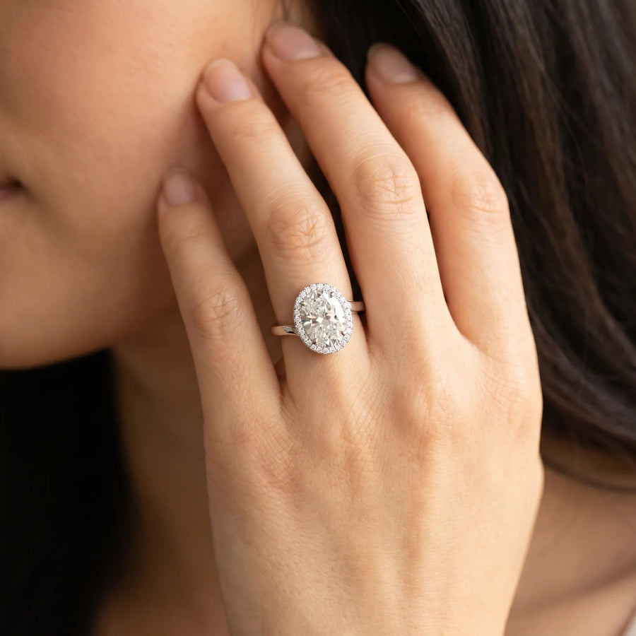 White gold Oval Diamond Bezel Halo Ring with Plain Band