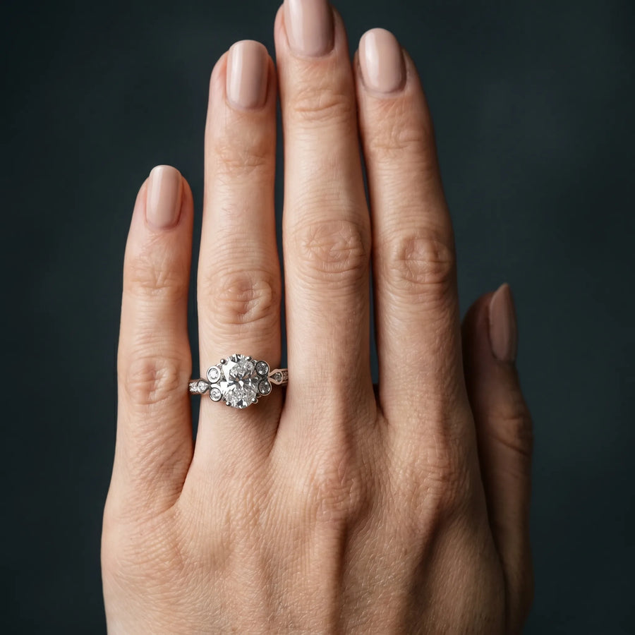 White gold Oval Diamond Bezel and Prong Setting with Pave Band