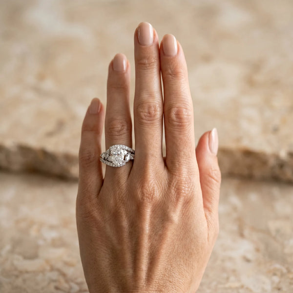 White gold Oval Diamond Halo Ring with Marquise and Pavé Band in Prong Setting
