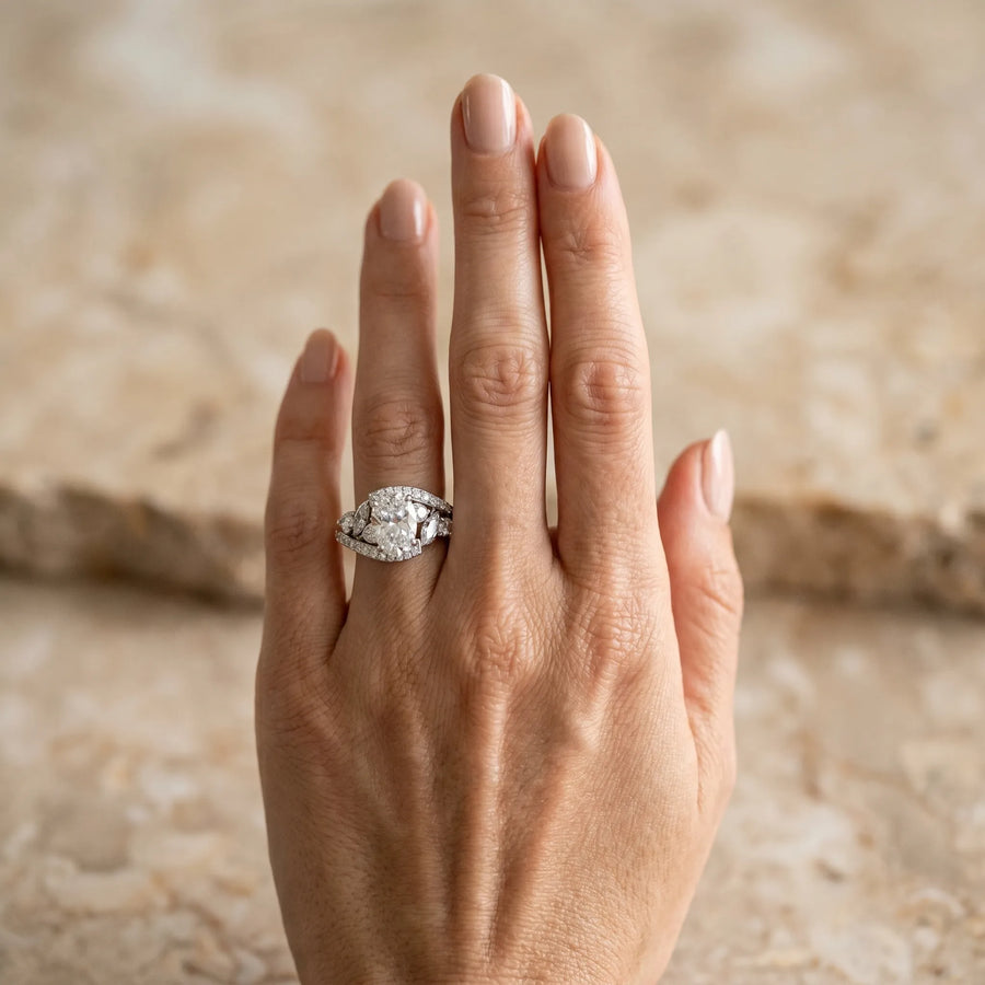 White gold Oval Diamond Halo Ring with Marquise and Pavé Band in Prong Setting