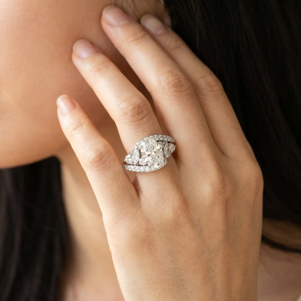 White gold Oval Diamond Halo Ring with Marquise and Pavé Band in Prong Setting