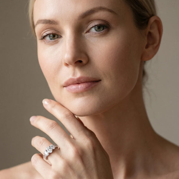 White gold Oval Diamond Three-Stone Ring with Prong Setting and Textured Band