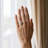 Platinum 4.01 Carat F VVS2 Oval Diamond Three-Stone Ring with Prong Setting and Textured Band