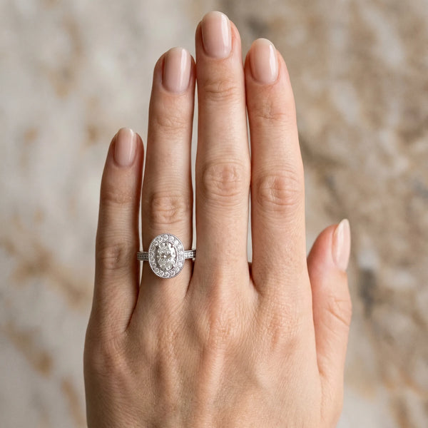 White gold Oval Halo Diamond Engagement Ring with Pave Band and Four-Prong Setting