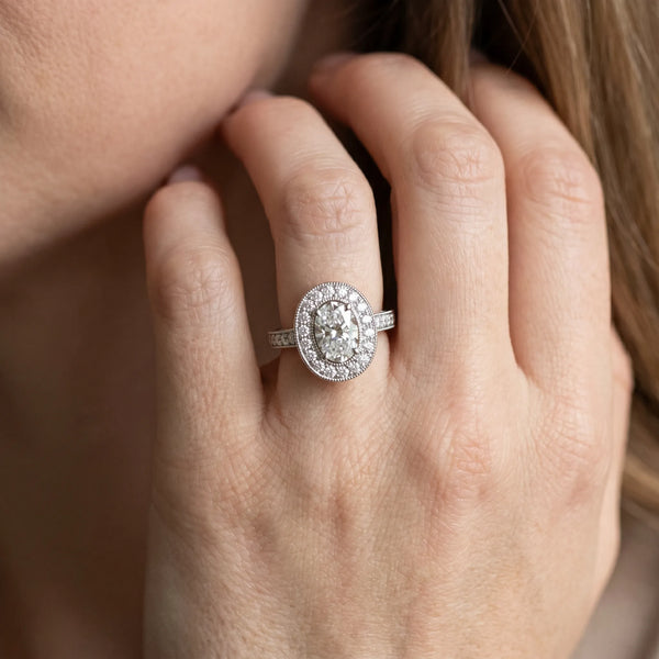 White gold Oval Halo Diamond Engagement Ring with Pave Band and Four-Prong Setting