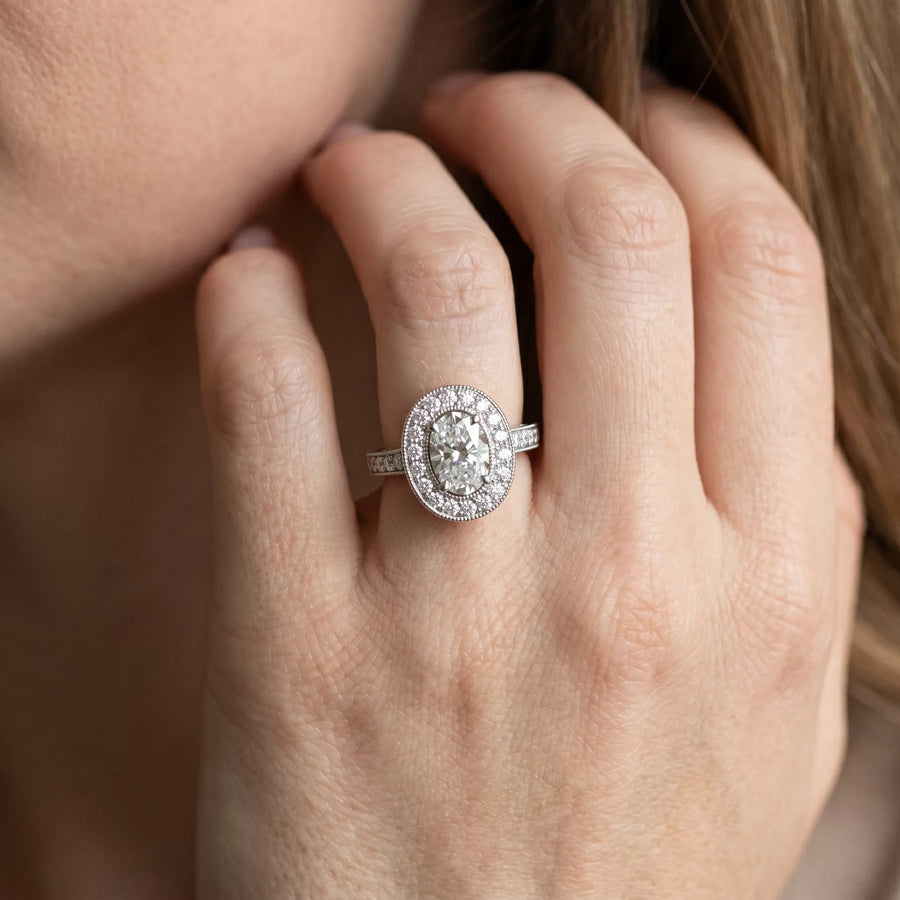 White gold Oval Halo Diamond Engagement Ring with Pave Band and Four-Prong Setting