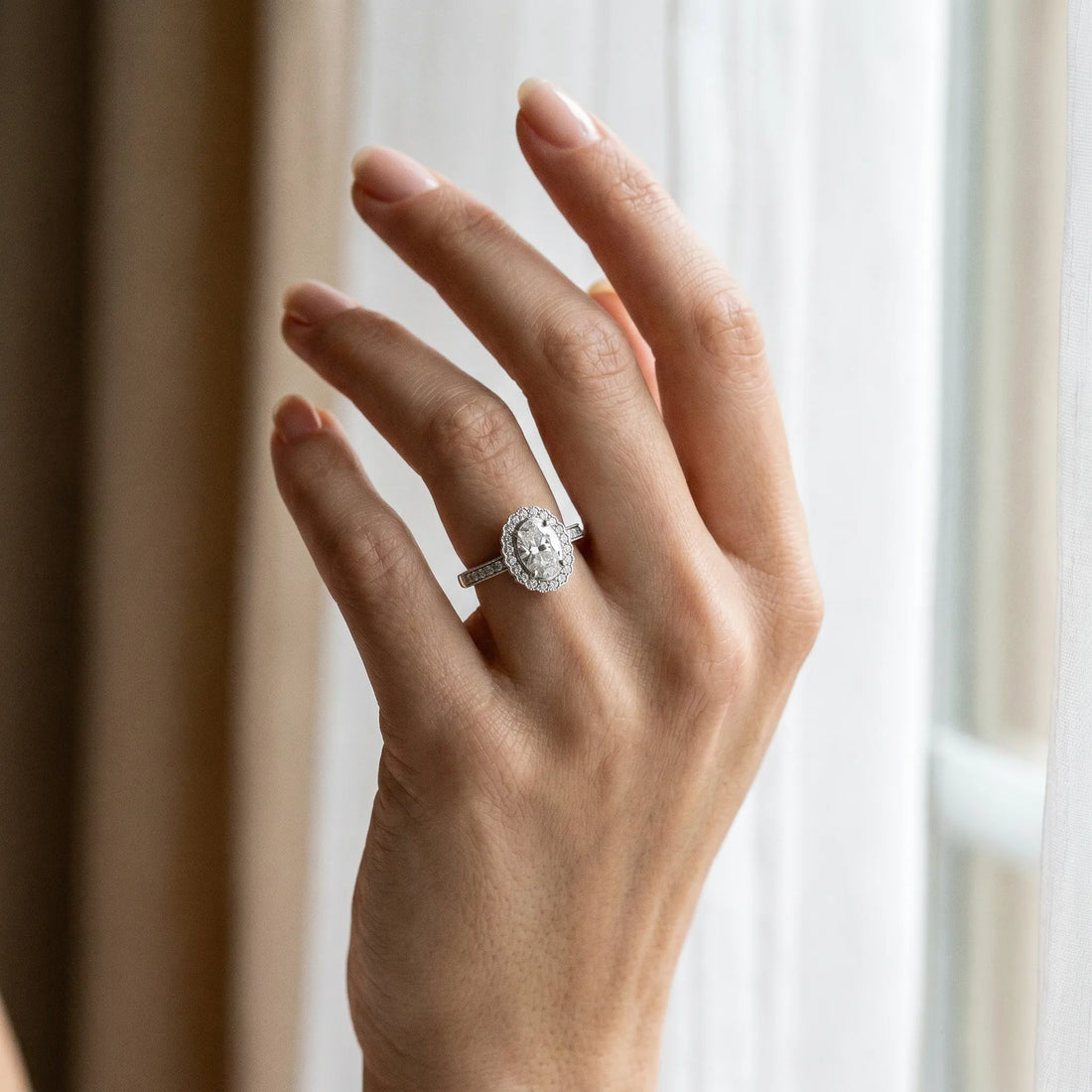 White gold Oval Halo Diamond Ring with Pavé Band and Four-Prong Setting_6