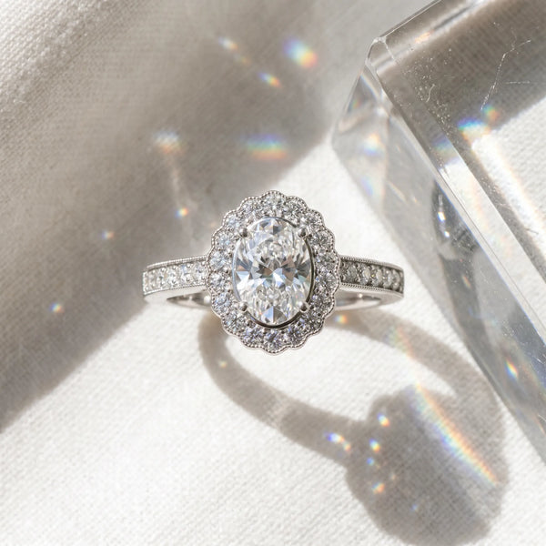 White gold Oval Halo Diamond Ring with Pavé Band and Four-Prong Setting
