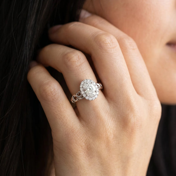 White gold Oval Halo Diamond Ring with Scrollwork Band and Four-Prong Setting