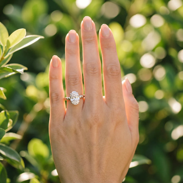 White gold Oval Solitaire Beaded Band with Four-Prong Setting
