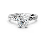 White gold Oval Solitaire Diamond Engagement Ring with XO Engraved Band and Four-Prong Setting