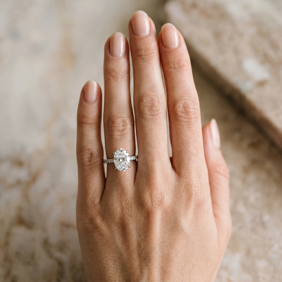 White gold Oval Solitaire Diamond Ring with Four-Prong Setting on a Tapered Band