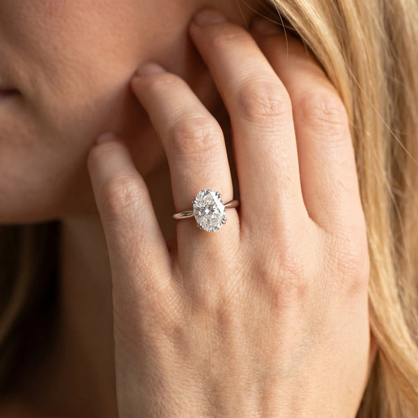 White gold Oval Solitaire Diamond Ring with Four-Prong Setting on a Tapered Band