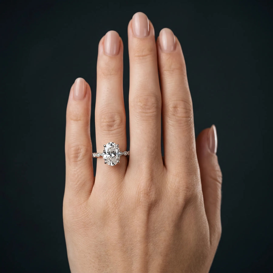 White gold Oval Solitaire Diamond Ring with Infinity Twist Band and Four-Prong Setting