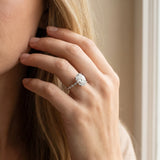 White gold Oval Solitaire Diamond Ring with Infinity Twist Band and Four-Prong Setting_26