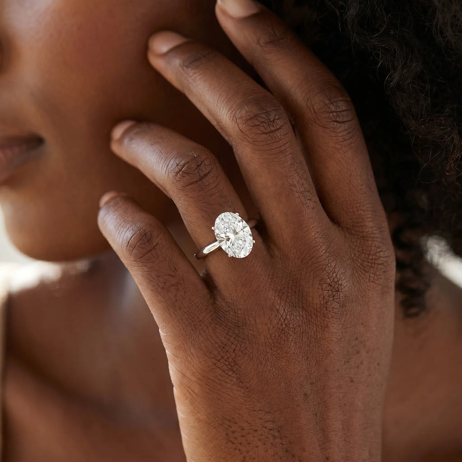 White gold Oval Solitaire Diamond Ring with Split Shank and Four-Prong Setting