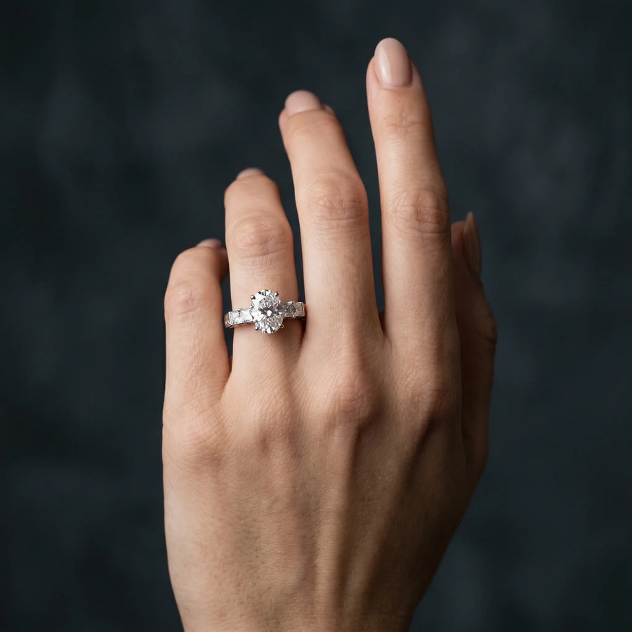 White gold Oval Solitaire Princess Side Stone Engraved Band Prong Setting Ring