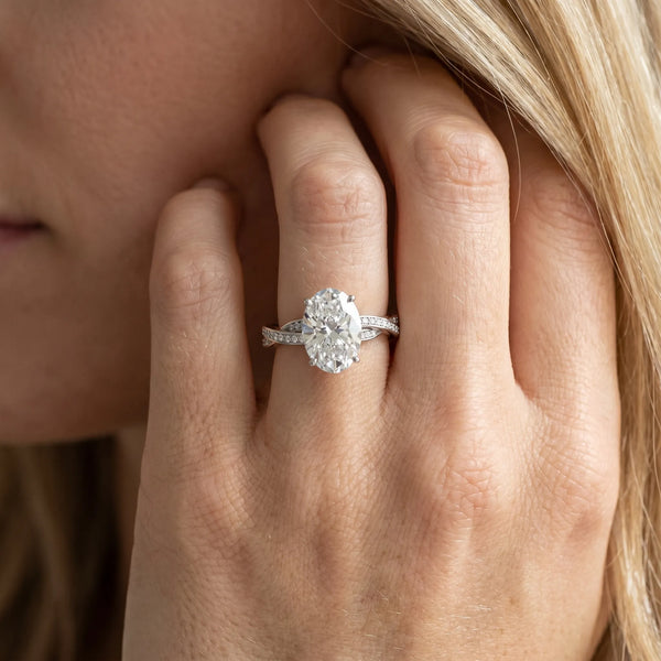 White gold Oval Solitaire Twisted Pave Diamond Ring with Four-Prong Setting