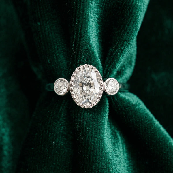 White gold Oval Three-Stone Bezel Set Diamond Ring with Solitaire Band