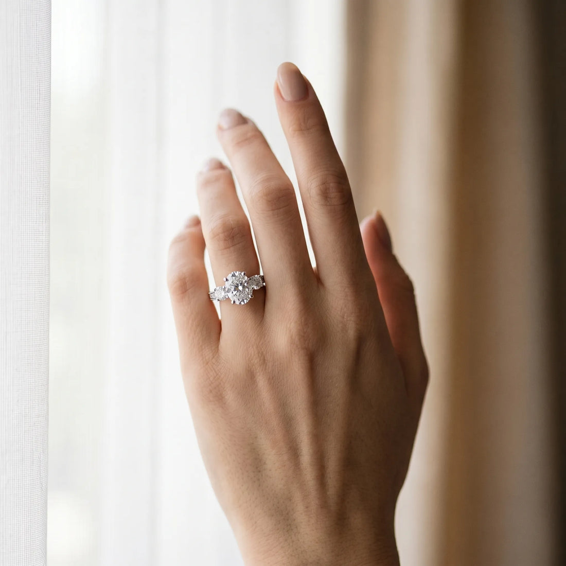 White gold Oval Three-Stone Diamond Ring with Pavé Band and Four-Prong Setting_57
