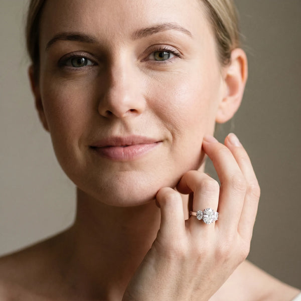 White gold Oval Three-Stone Diamond Ring with Prong Setting on a Classic Band