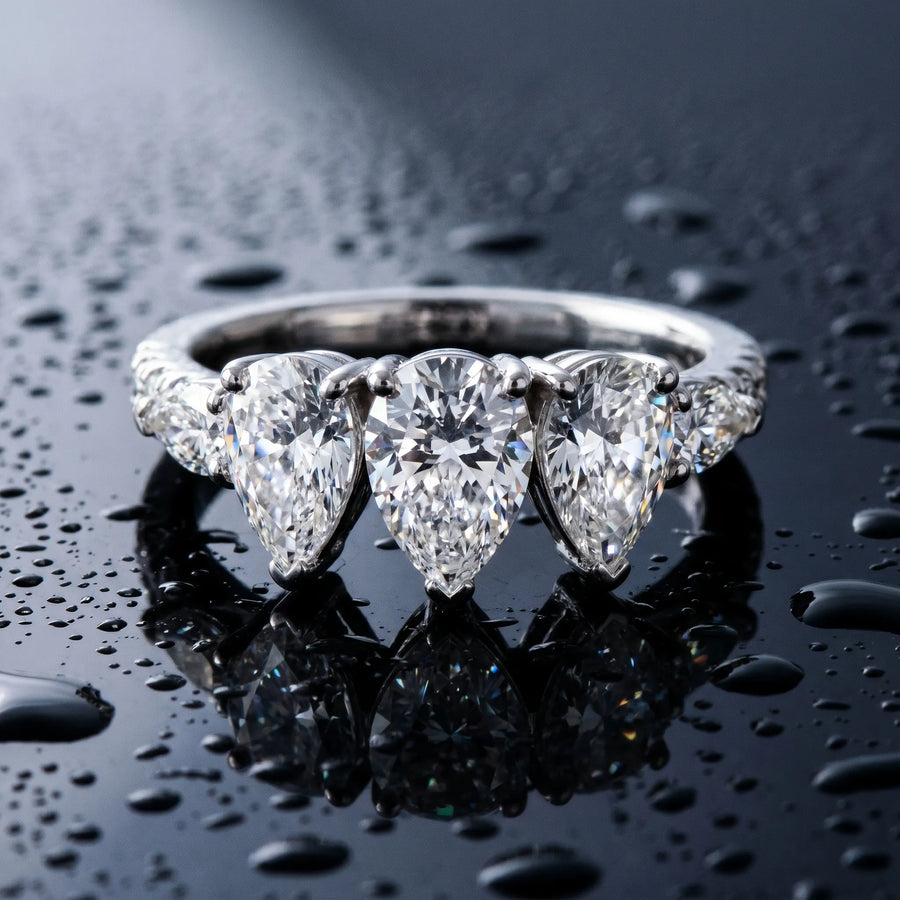 White gold Pear Brilliant Trilogy Channel Set Diamond Ring with Bar Prongs