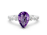 White gold Pear Cut Amethyst Solitaire with Side Stones on a Pavé Band and Four-Prong Setting