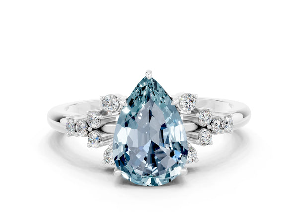 Platinum Pear Cut Aquamarine Ring with Side Stones and Four-Prong Setting