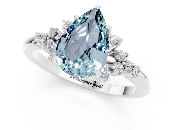 Silver Pear Cut Aquamarine Ring with Side Stones and Four-Prong Setting