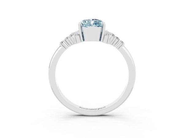 Platinum Pear Cut Aquamarine Ring with Side Stones and Four-Prong Setting