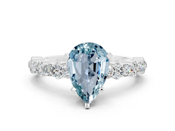 Platinum Pear Cut Aquamarine Side Stone Solitaire Ring with Round  and Four-Prong Setting