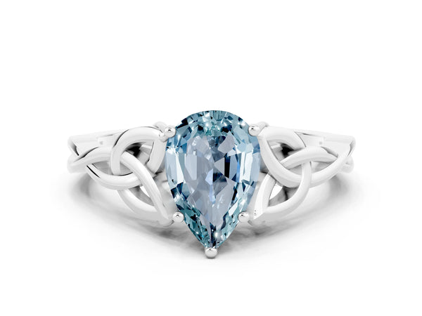 Platinum Pear Cut Aquamarine Solitaire Engagement Ring with Celtic Knot Band and Four-Prong Setting