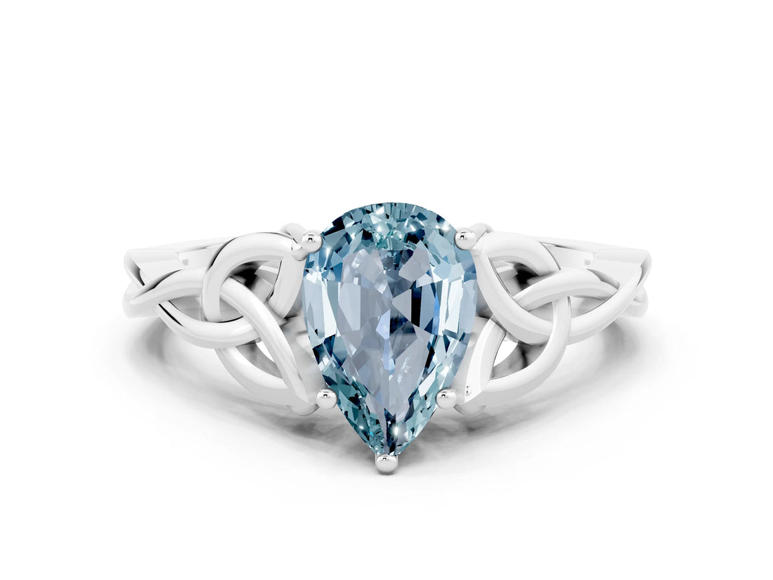 White gold Pear Cut Aquamarine Solitaire Engagement Ring with Celtic Knot Band and Four-Prong Setting