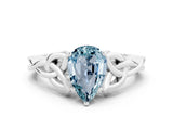 White gold Pear Cut Aquamarine Solitaire Engagement Ring with Celtic Knot Band and Four-Prong Setting