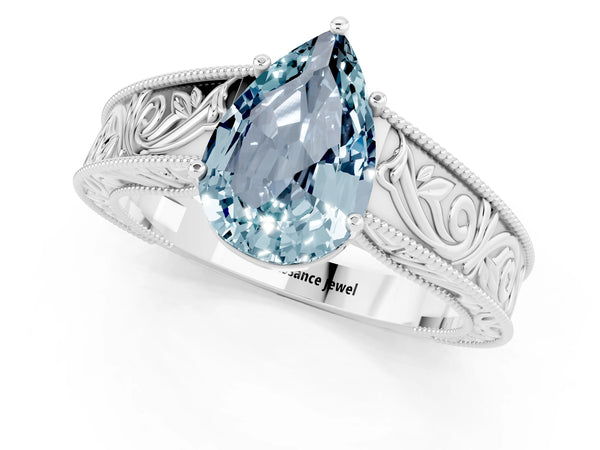 Silver Pear Cut Aquamarine Solitaire Ring with Engraved Band and Four-Prong Setting