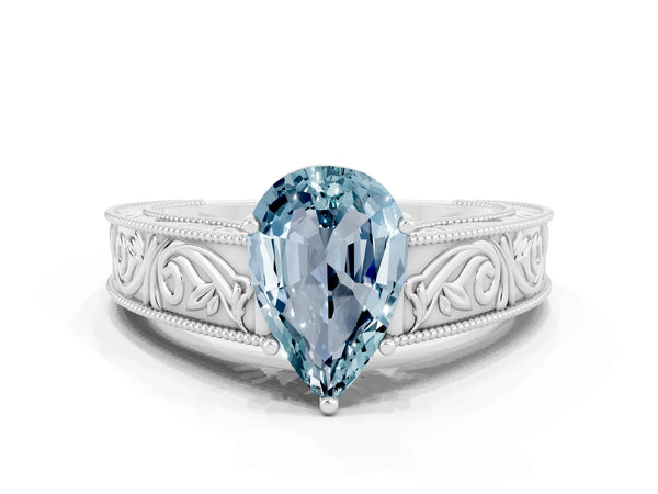 Silver Pear Cut Aquamarine Solitaire Ring with Engraved Band and Four-Prong Setting