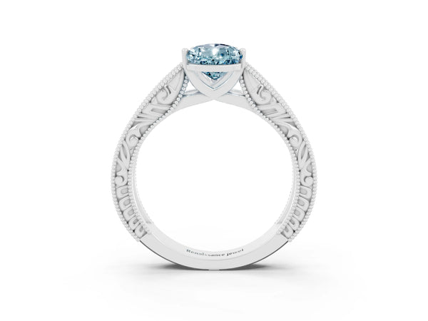 Platinum Pear Cut Aquamarine Solitaire Ring with Engraved Band and Four-Prong Setting