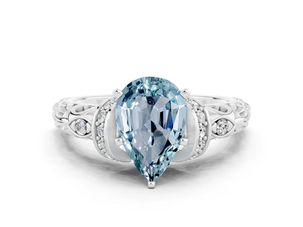 Silver Pear Cut Aquamarine Solitaire Ring with Filigree Band and Four-Prong Setting