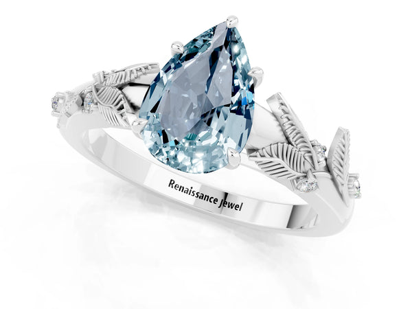 White gold Pear Cut Aquamarine Solitaire Ring with Leaf Motif Band and Four-Prong Setting