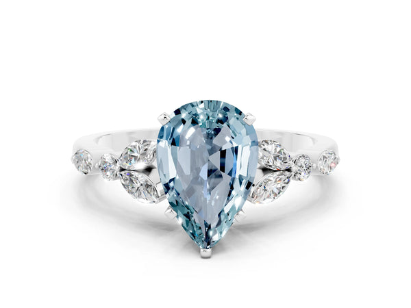 White gold Pear Cut Aquamarine Solitaire Ring with Side Stones and Four-Prong Setting
