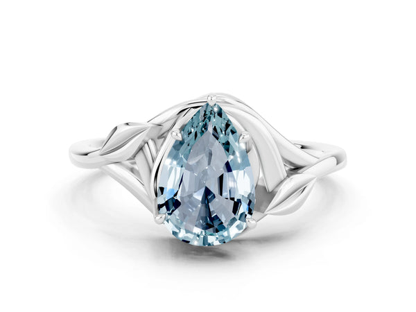 Silver Pear Cut Aquamarine Solitaire Ring with Twist Band and Four-Prong Setting