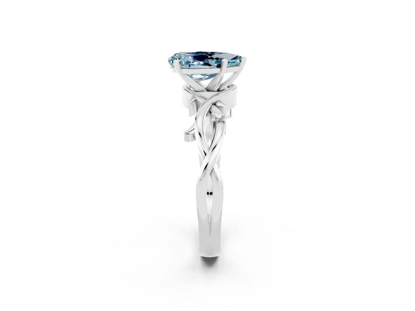 White gold Pear Cut Aquamarine Solitaire Ring with Twisted Band and Prong Setting
