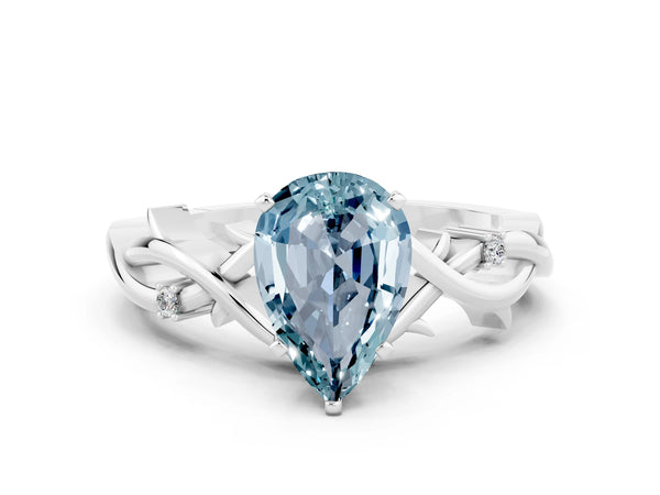 Silver Pear Cut Aquamarine Solitaire Ring with Twisted Band and Prong Setting