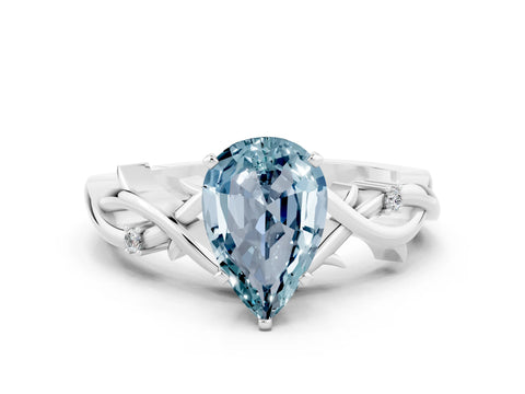 White gold Pear Cut Aquamarine Solitaire Ring with Twisted Band and Prong Setting