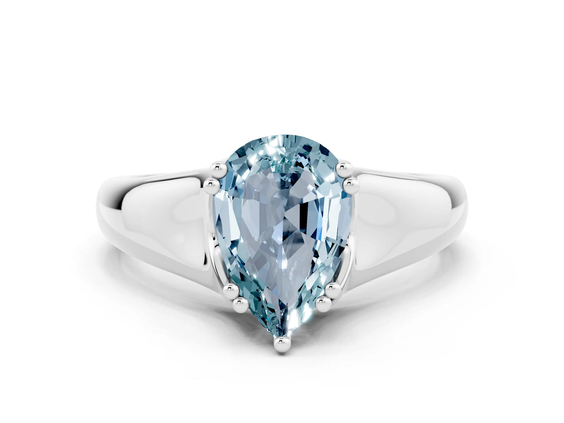 White gold Pear Cut Aquamarine Solitaire Ring with Wide Band and Prong Setting