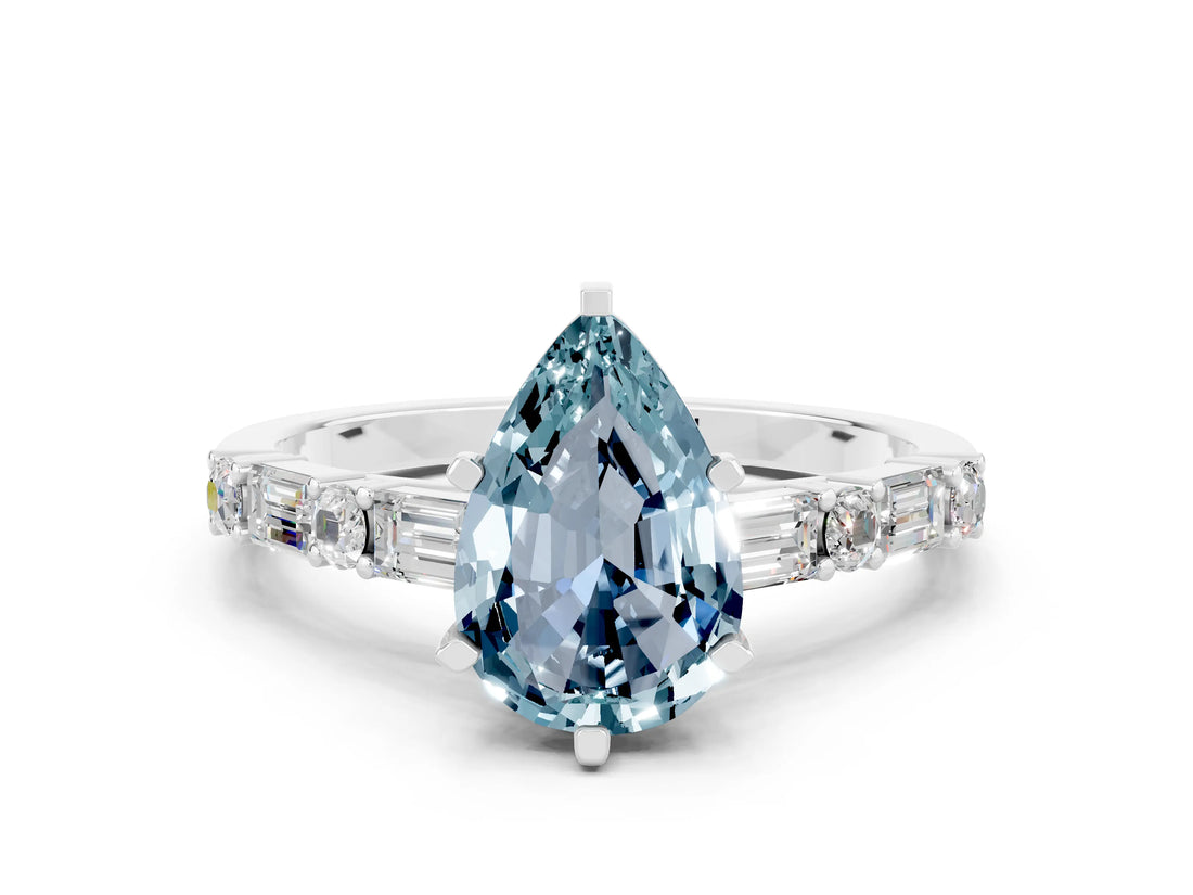 White gold Pear Cut Aquamarine Solitaire with Side Baguettes and Channel Set Band
